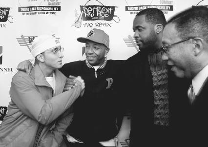 From left, rapper Eminem, Russell Simmons, Detroit mayor Kwame Kilpatrick, and Dr. Benjamin Chavis, CEO of the Hip-Hop Summitt, backstage at the 2003 Detroit Hip-Hop Summitt. AP/Wide World Photos. Reproduced by permission.